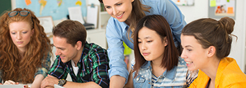 Four children preparing for the Cambridge English B1 Preliminary exam